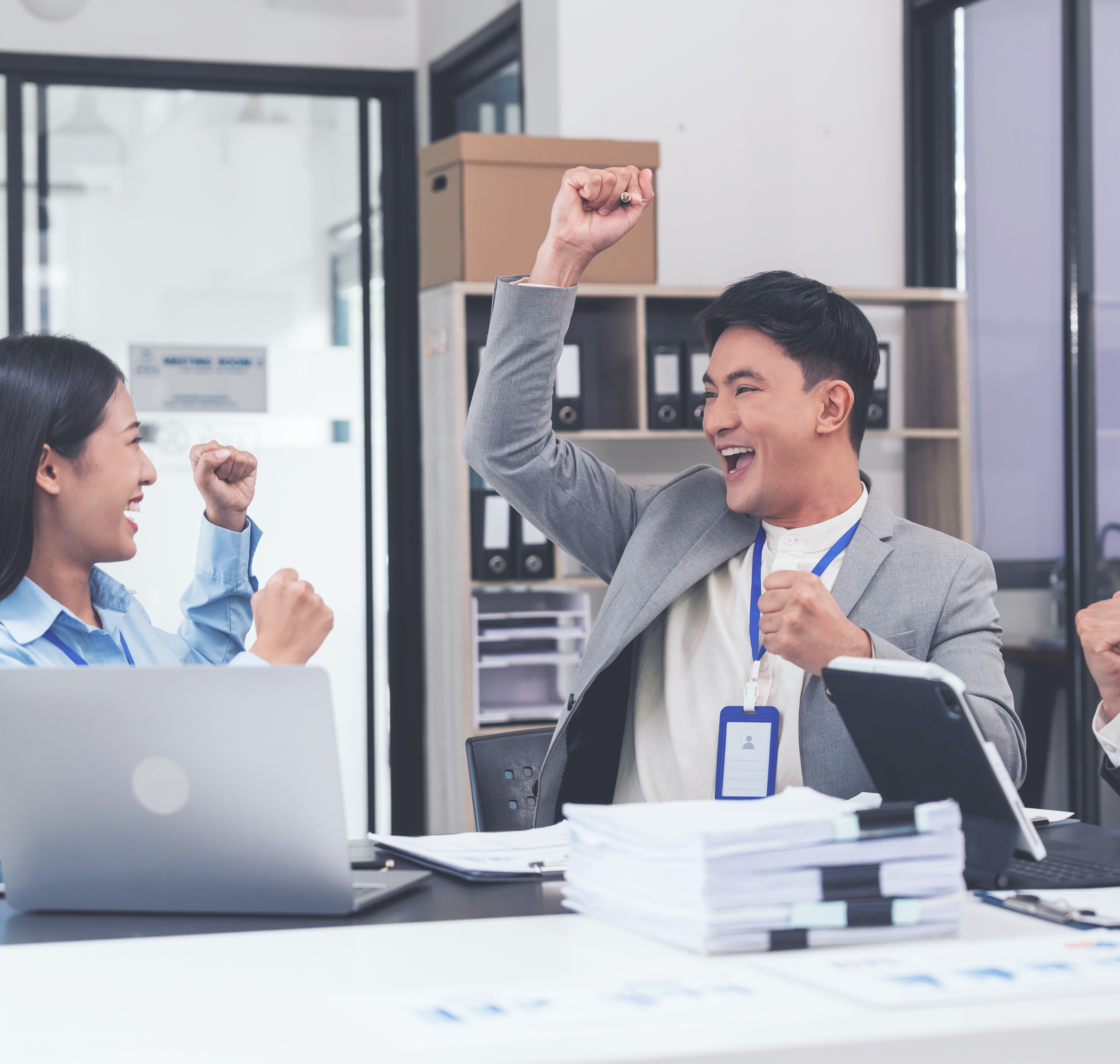 Two people high celebrating giving each other a high five