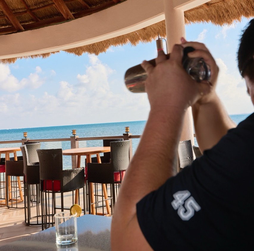 A bartender making cocktails.