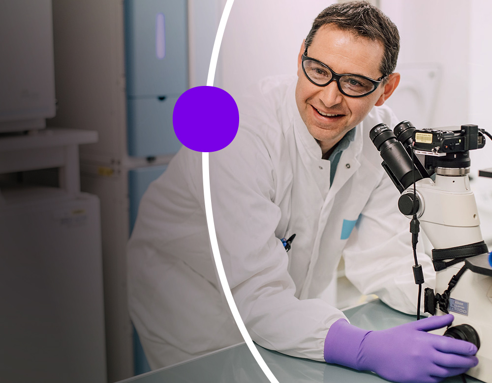 Sanofian in lab coat and safety glasses using laboratory instrument