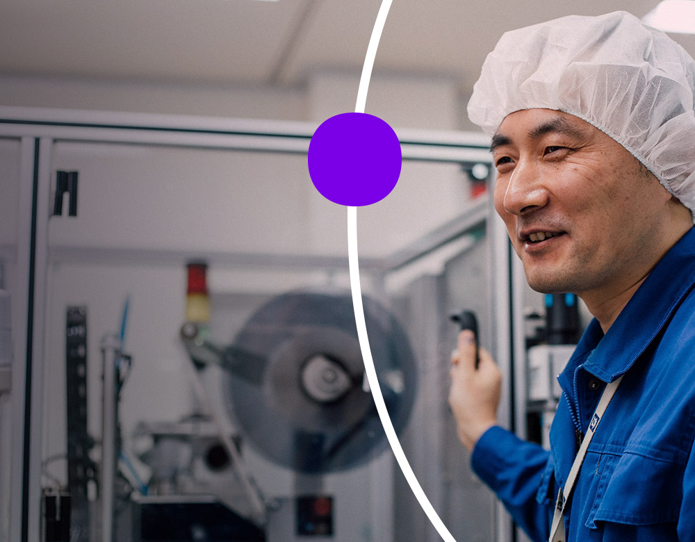 Employee in sterile clothing working in a lab
