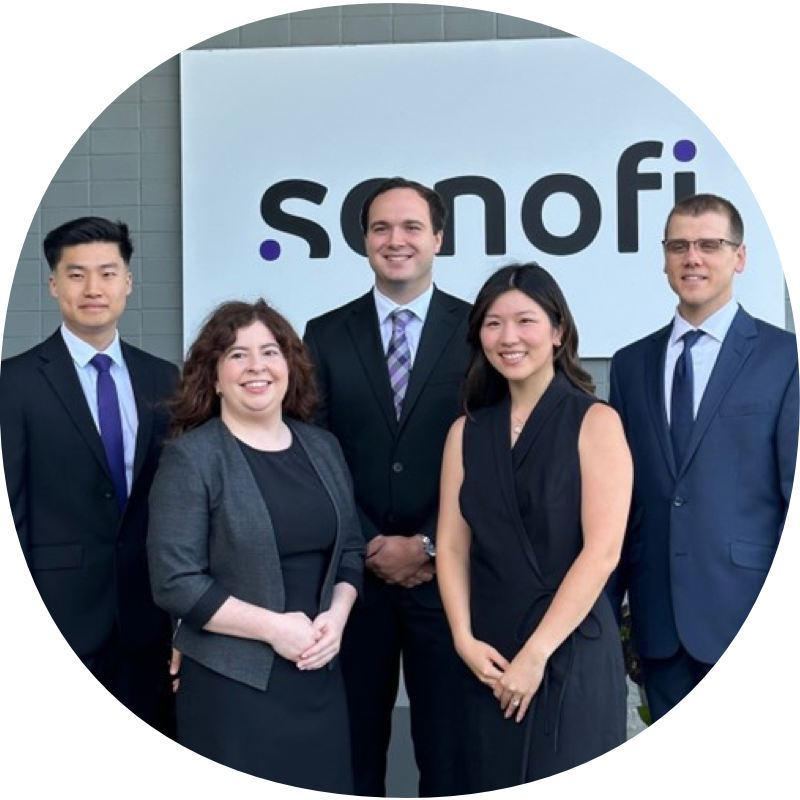 Group of 3 male and 2 female Sanofi employees stood smiling