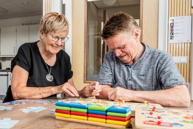 Two people working with yarn