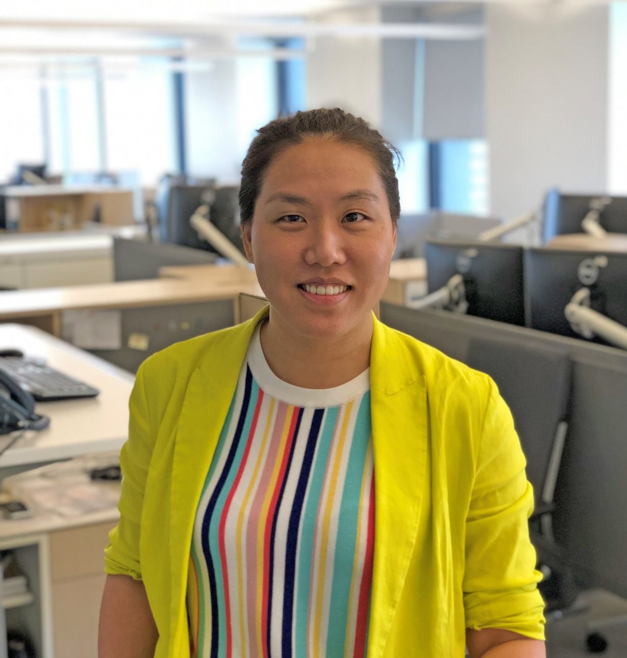 Young woman smiling into the camera.