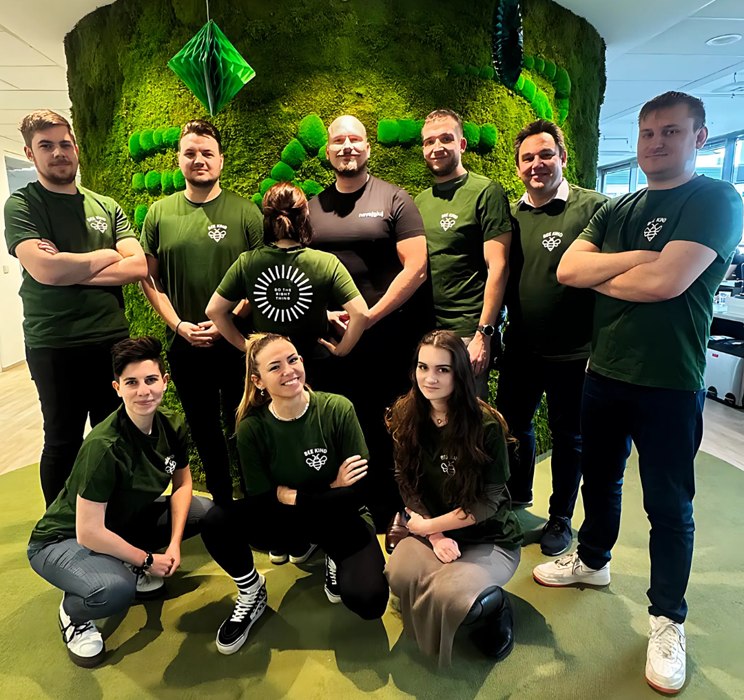 A group of employees from the BAT Czech Republic office wearing green shirts with Do The Right Thing value logo.