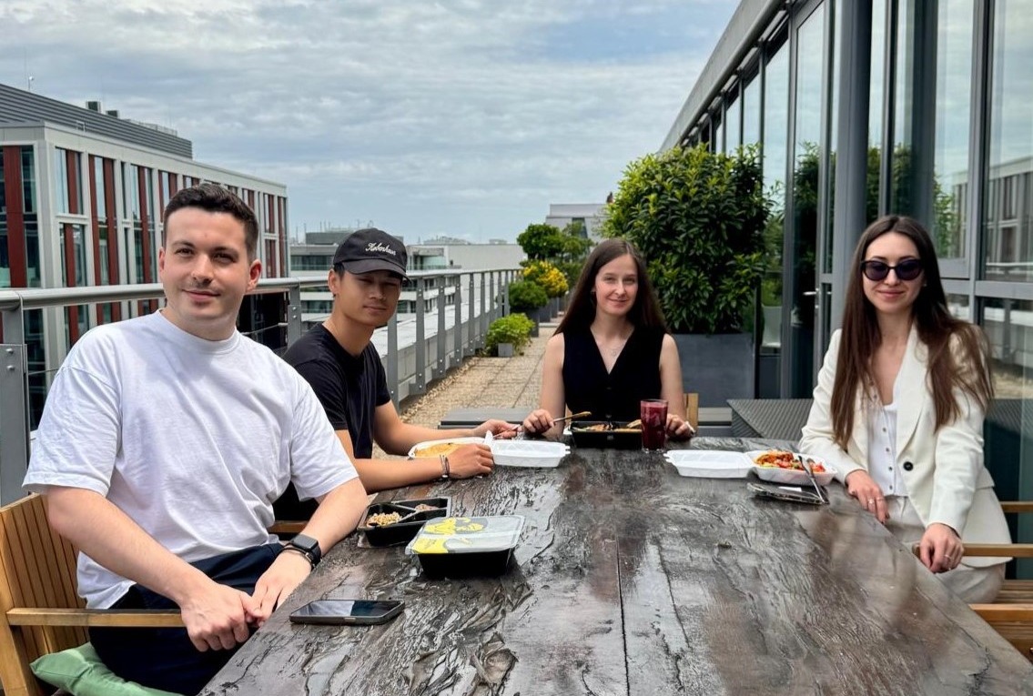 4 Global Graduates having lunch on the terrace