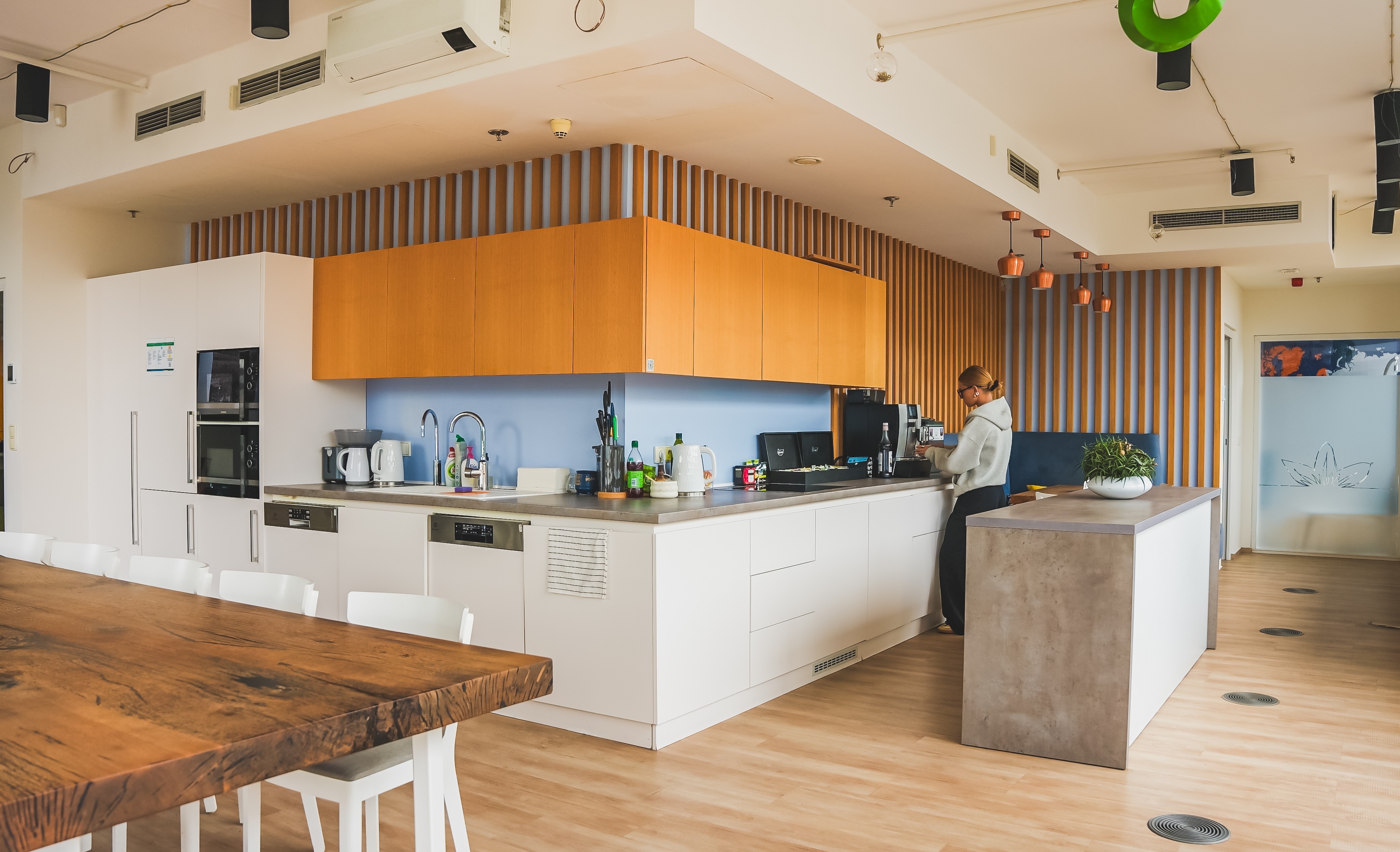 Office area in Czech Republic with employee using the spacious kitchenette