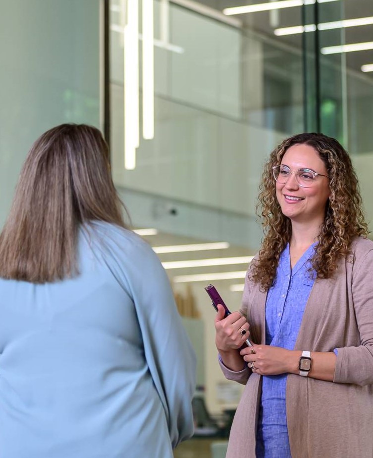 Employees smiling and talking