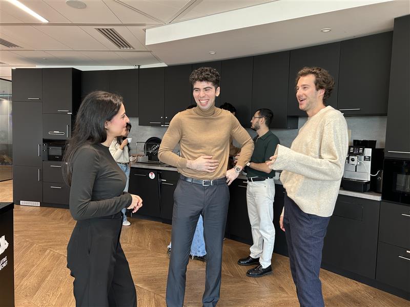 Employees standing in the kitchen area