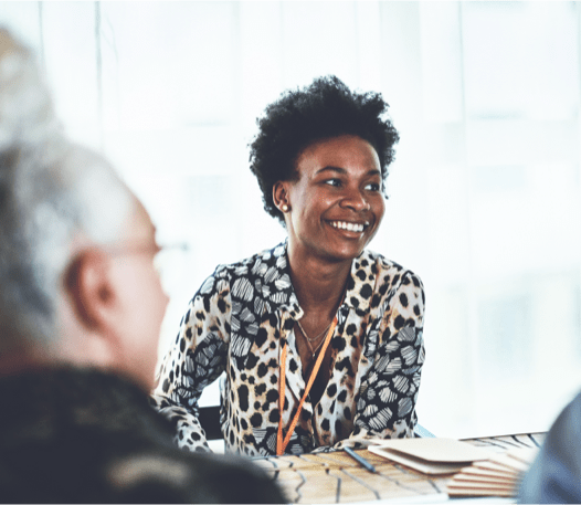 Three people smiling