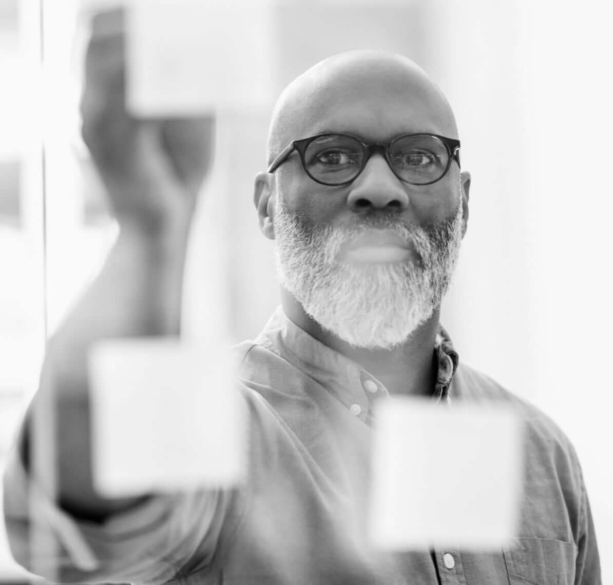 A man facing a board