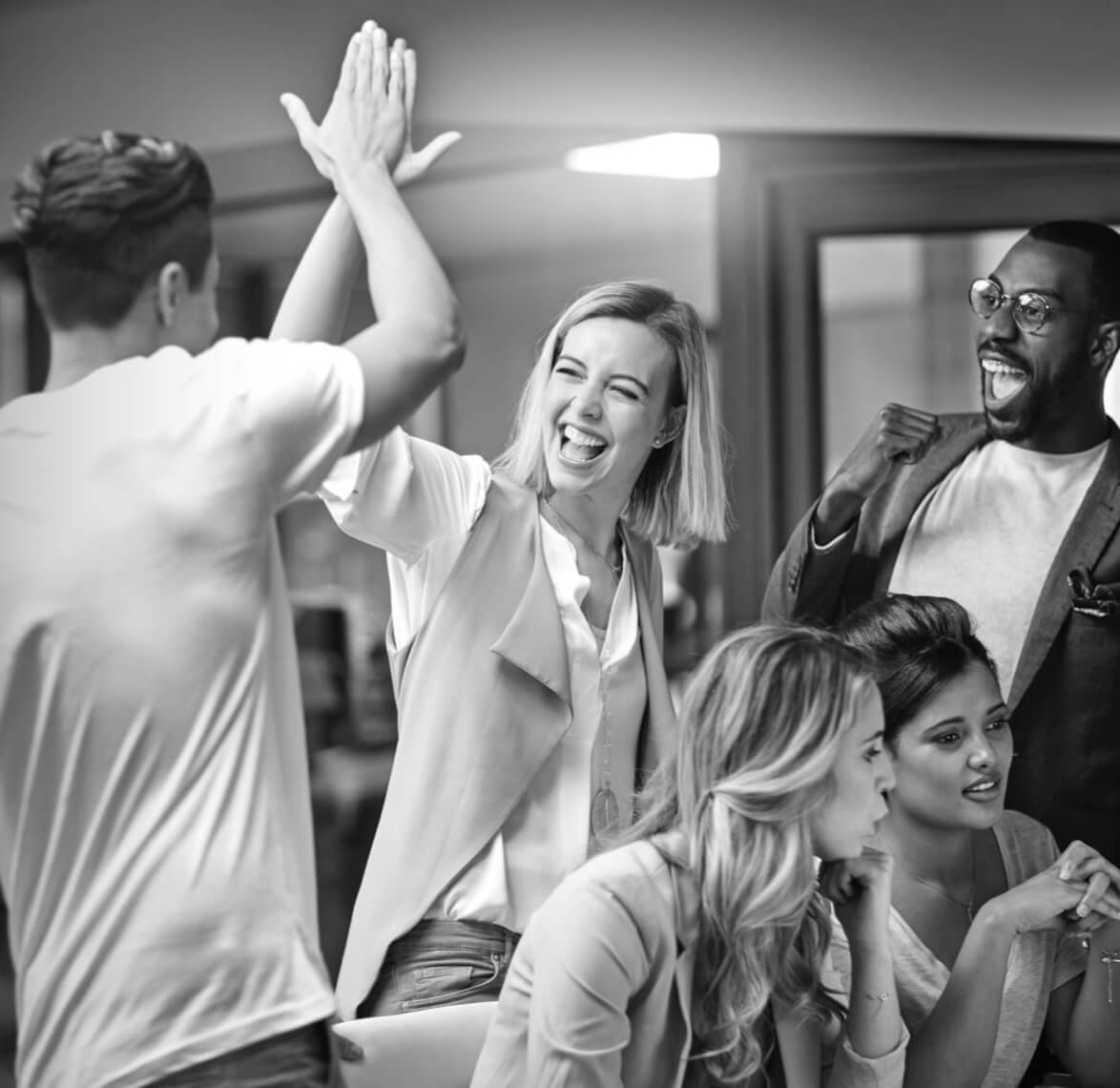 Two people high celebrating giving each other a high five