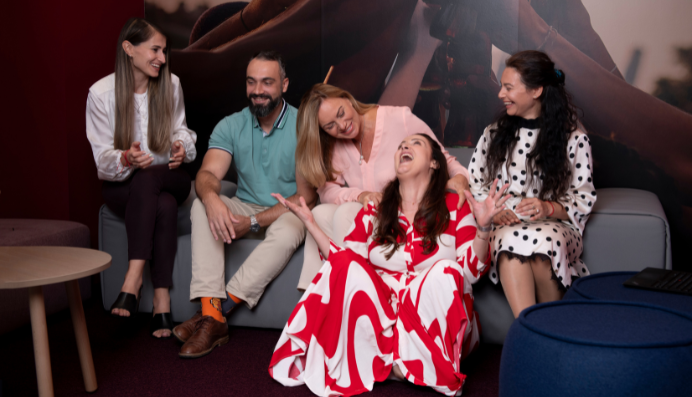 Group seated on sofa in discussion area