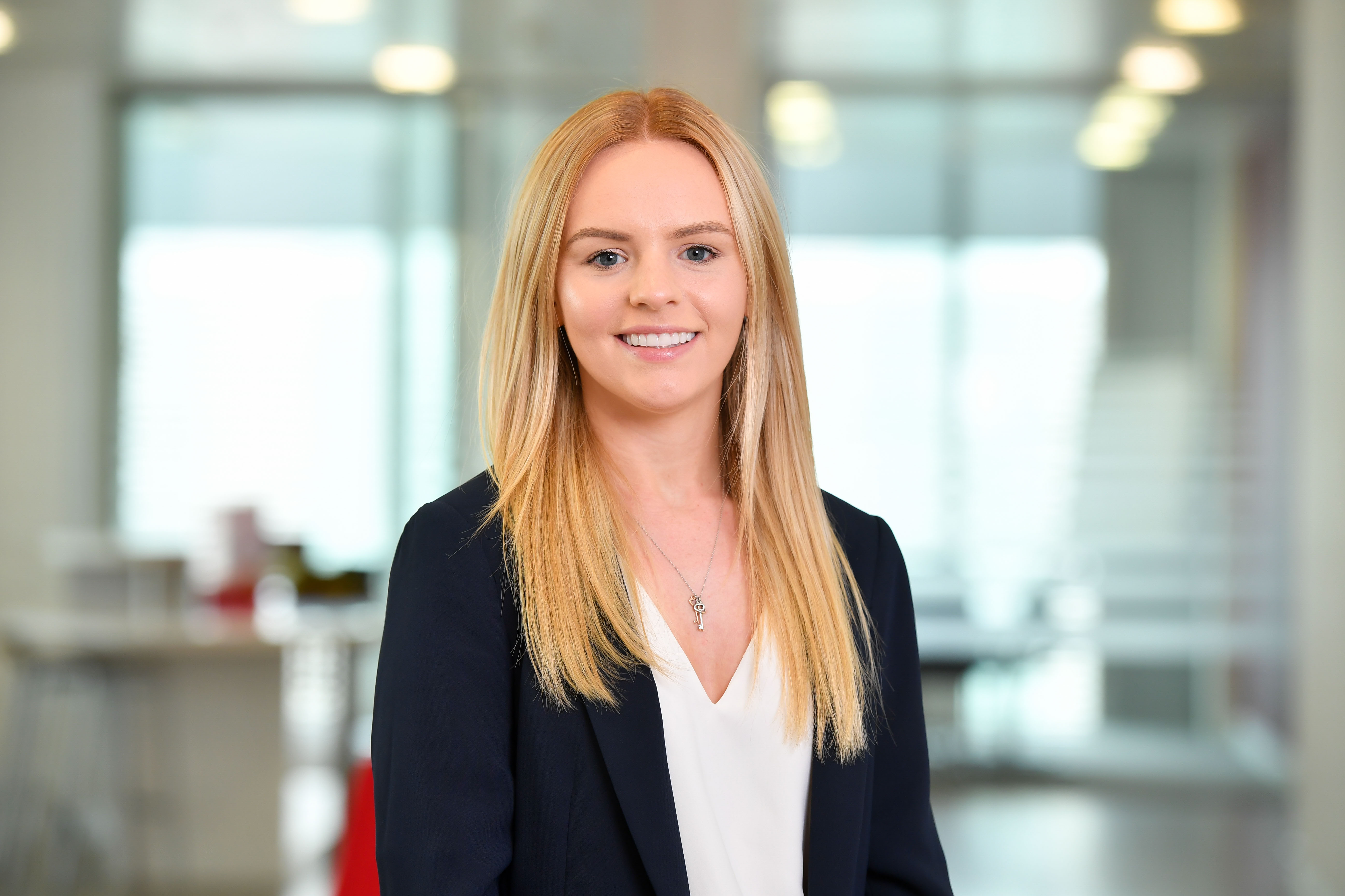 Image of Lucy Edwards smiling wearing suit jacket