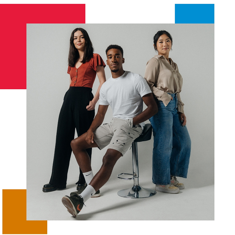 Three people posing in a studio portrait