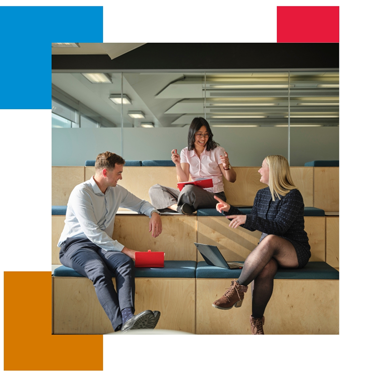 Three people chatting on office steps