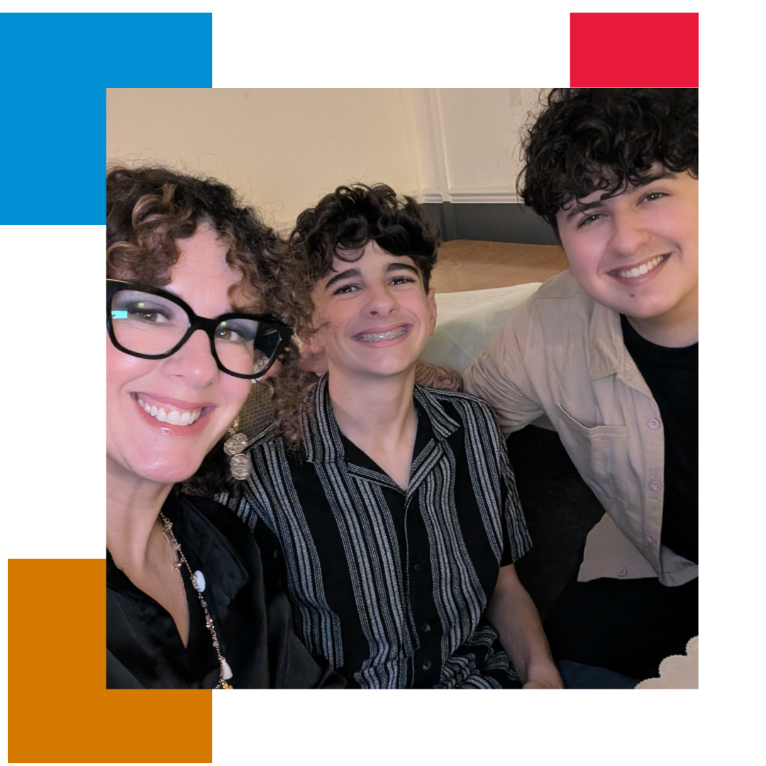 Woman and 2 kids sitting on a sofa taking a selfie picture and smiling