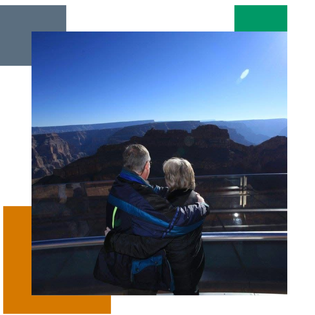 Man and woman standing on a viewing platform looking out over the horizon