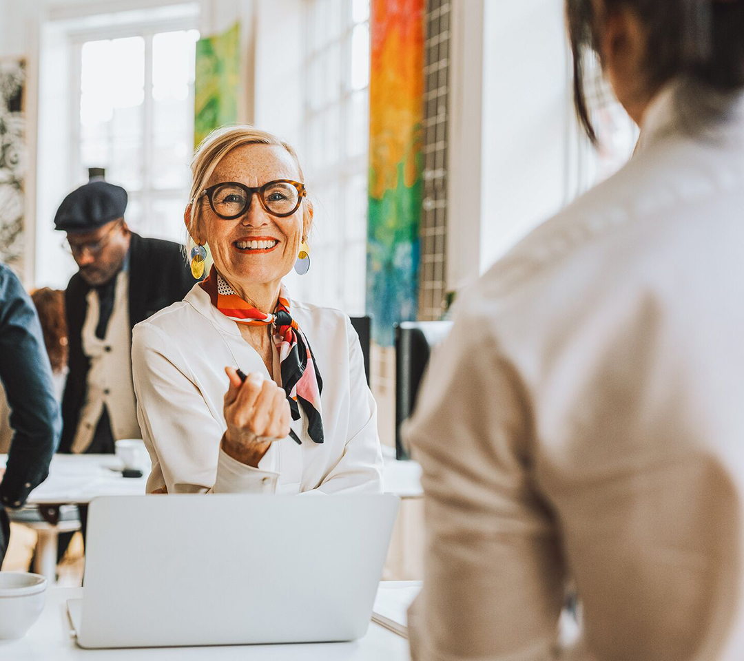 A middle-aged banker helps her client