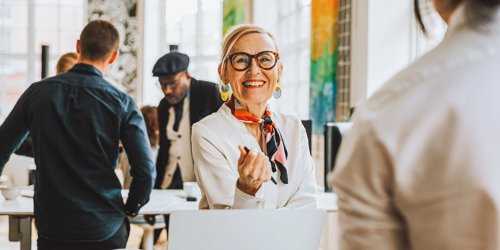 a woman smiles to another woman