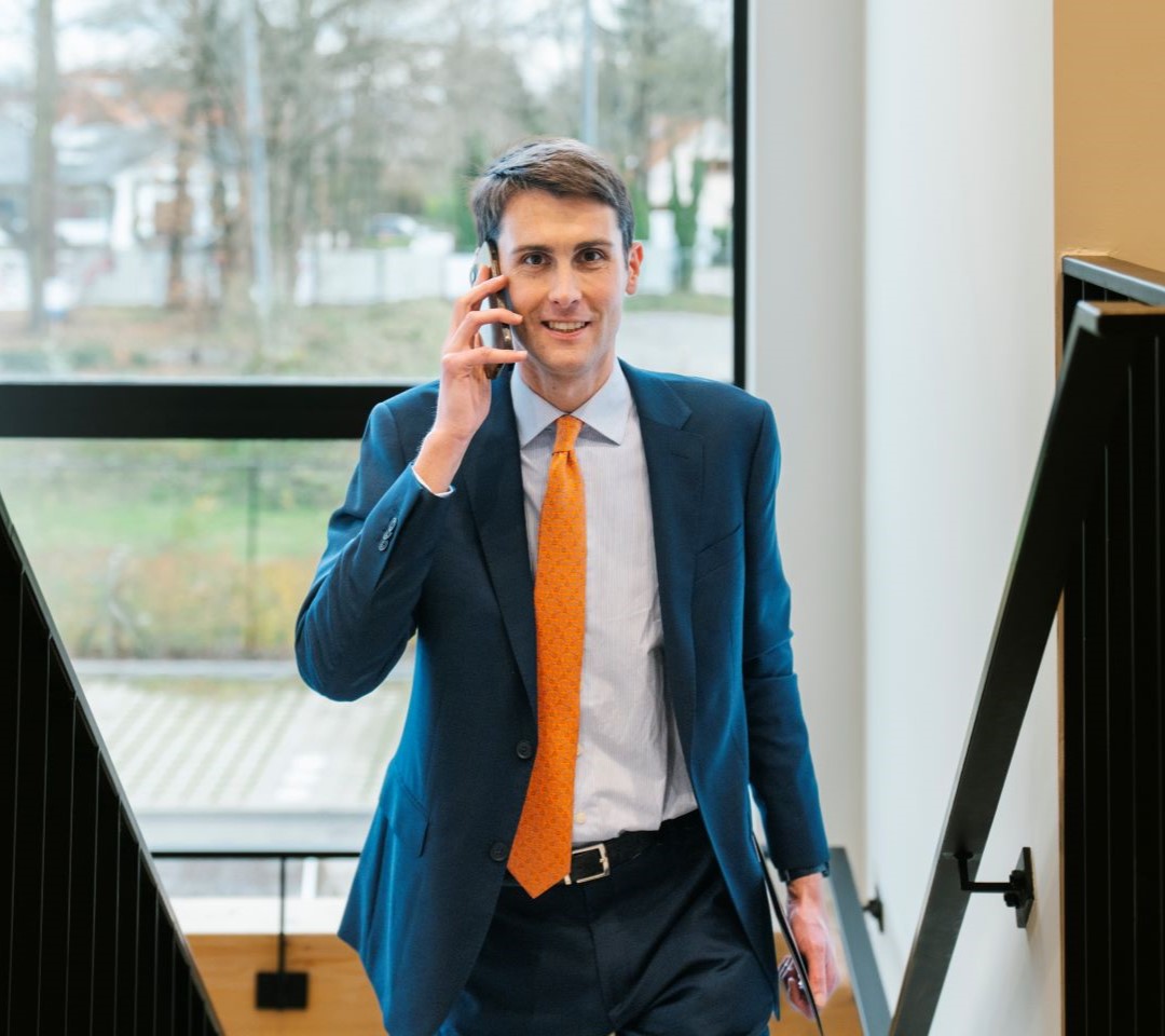 Ludovic is walking up the stairs while calling