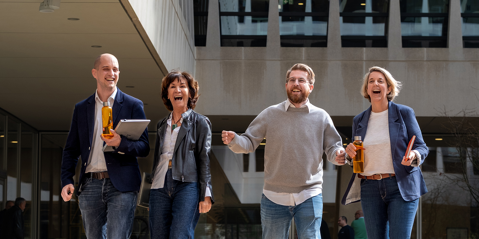 4 colleagues in front of the ING building
