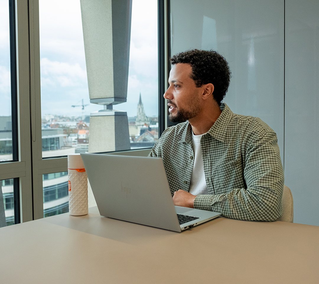 Malik is using his laptop