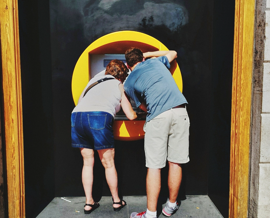 two people at an atm