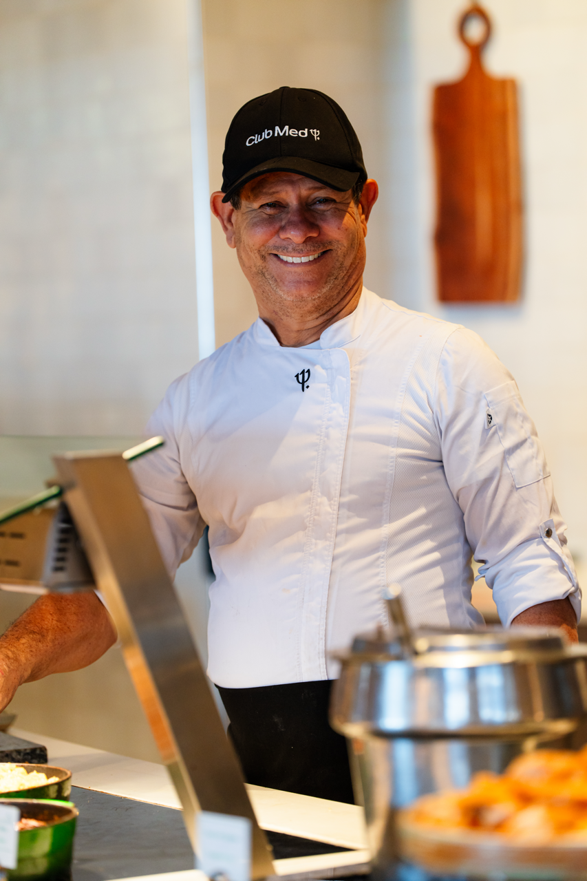 A Cooking employee smiling