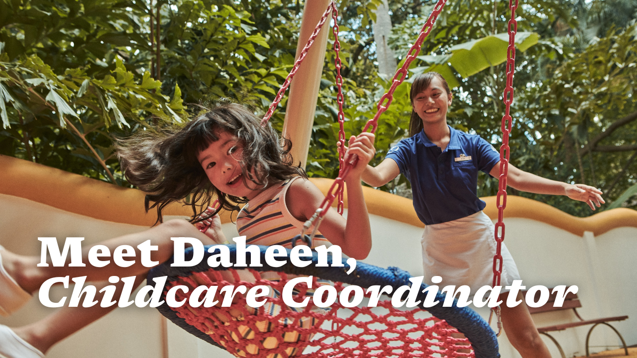 Shows a Childcare Coordinator playing with a kid.