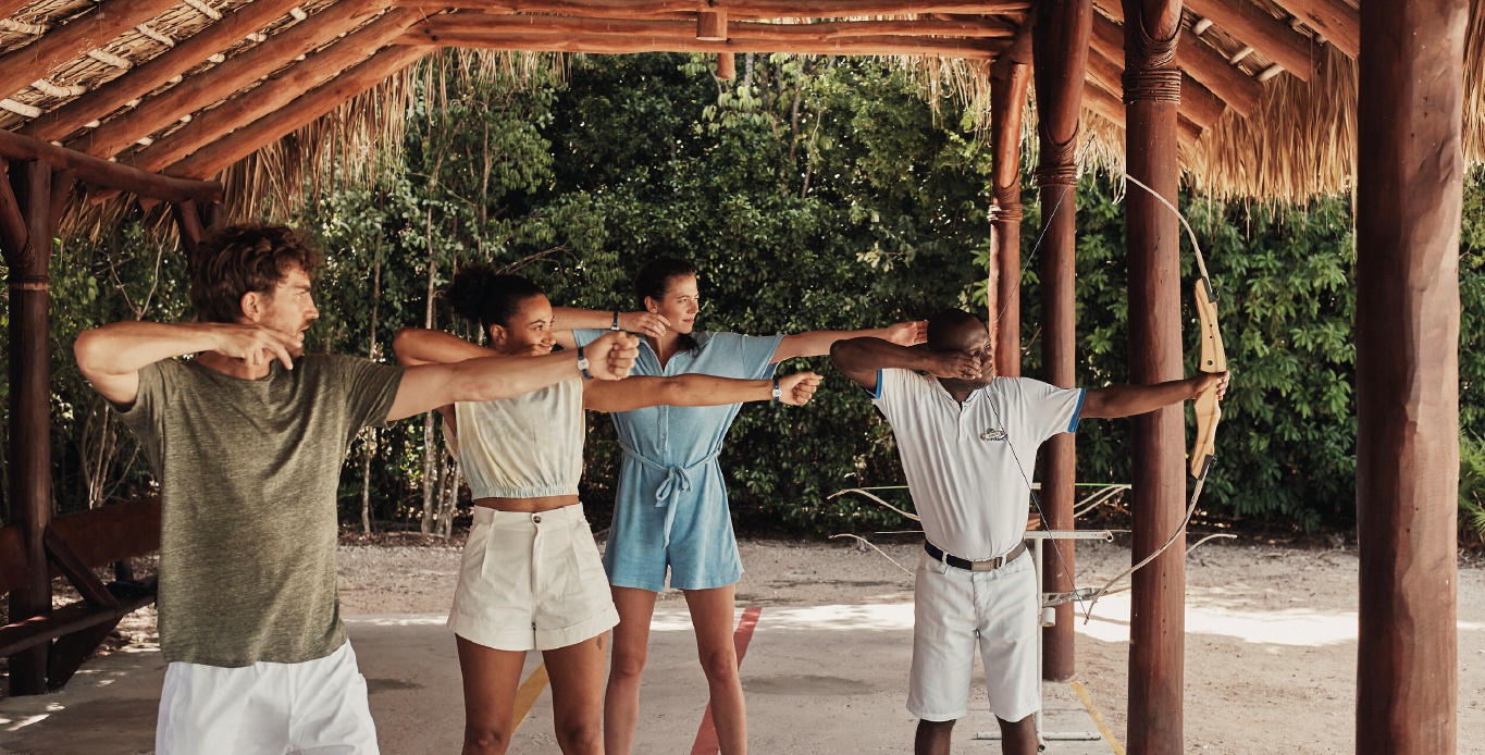 A G.O Archery teaching to a group of customers in a Club Med Resort
