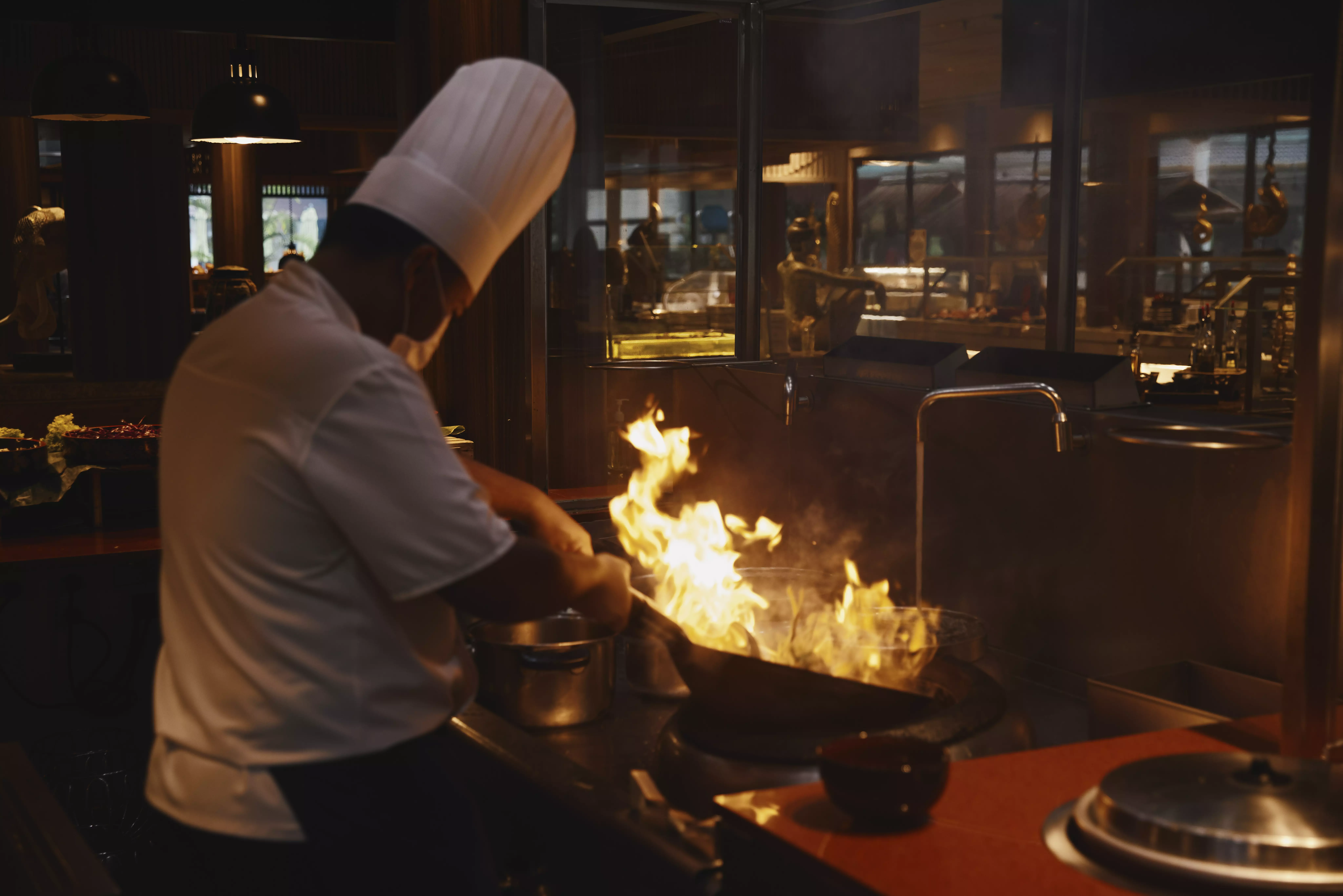 A Kitchen Chef preparing a dish at Club Med.