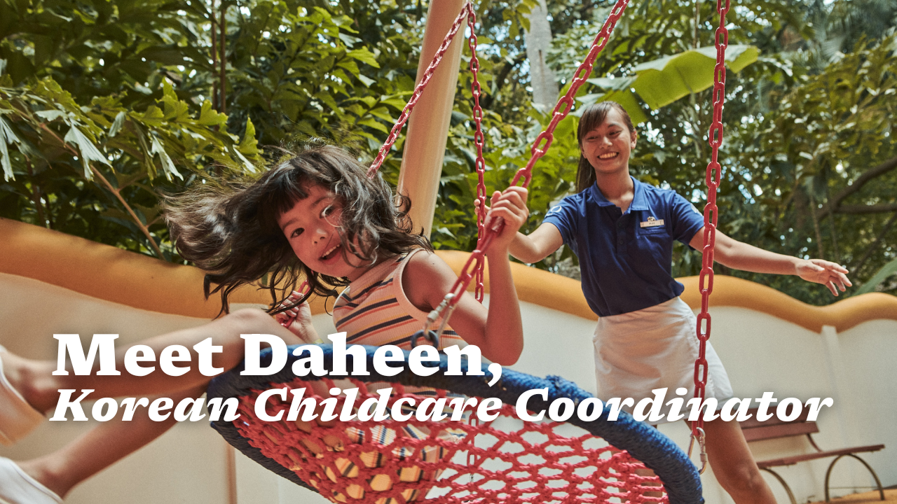 Shows a Childcare Coordinator playing with a kid.