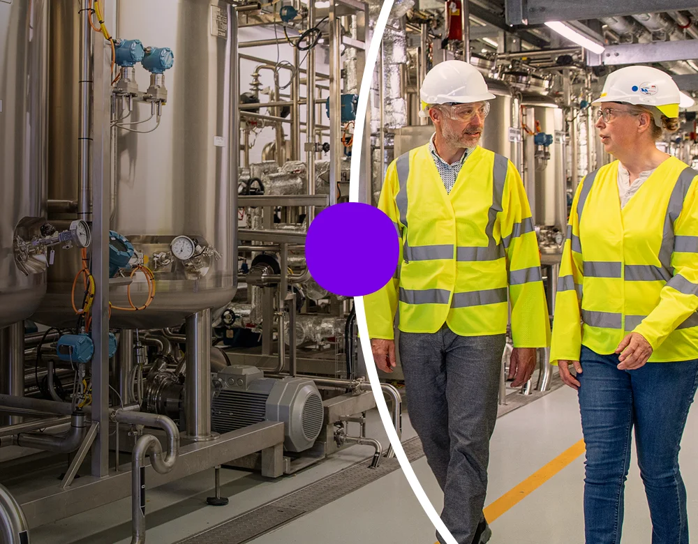 Two Sanofians walking through manufacturing location