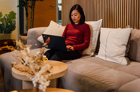 Sanofian working in the office on a laptop