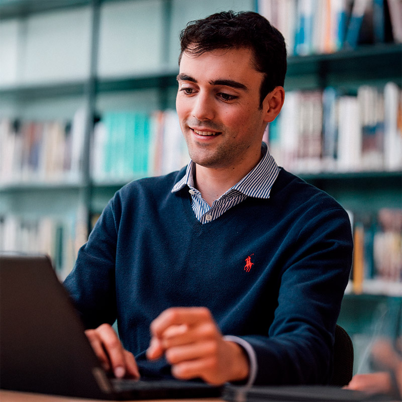 Sanofian working at laptop in the office