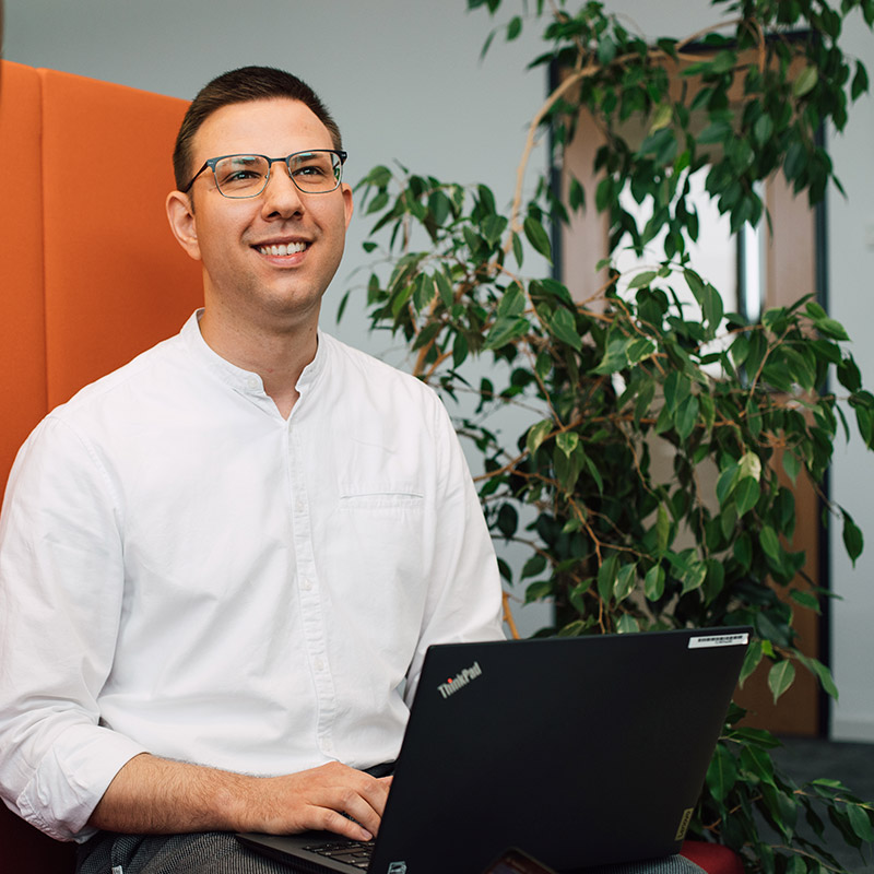 Sanofian working in a bright office space.