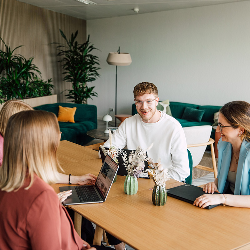 Four Sanofians in conversation in a meeting