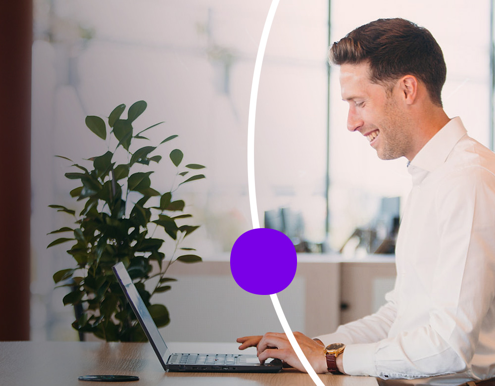 Sanofian working at a table in the office
