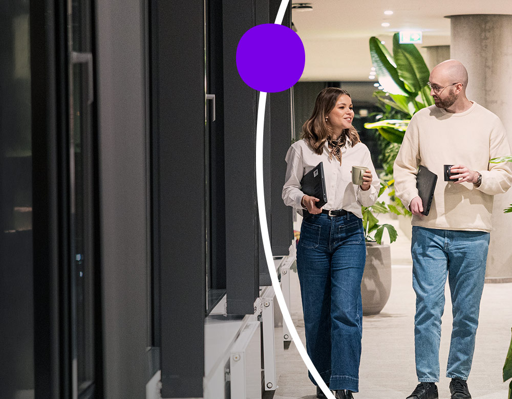 Sanofians drinking coffee and walking through office