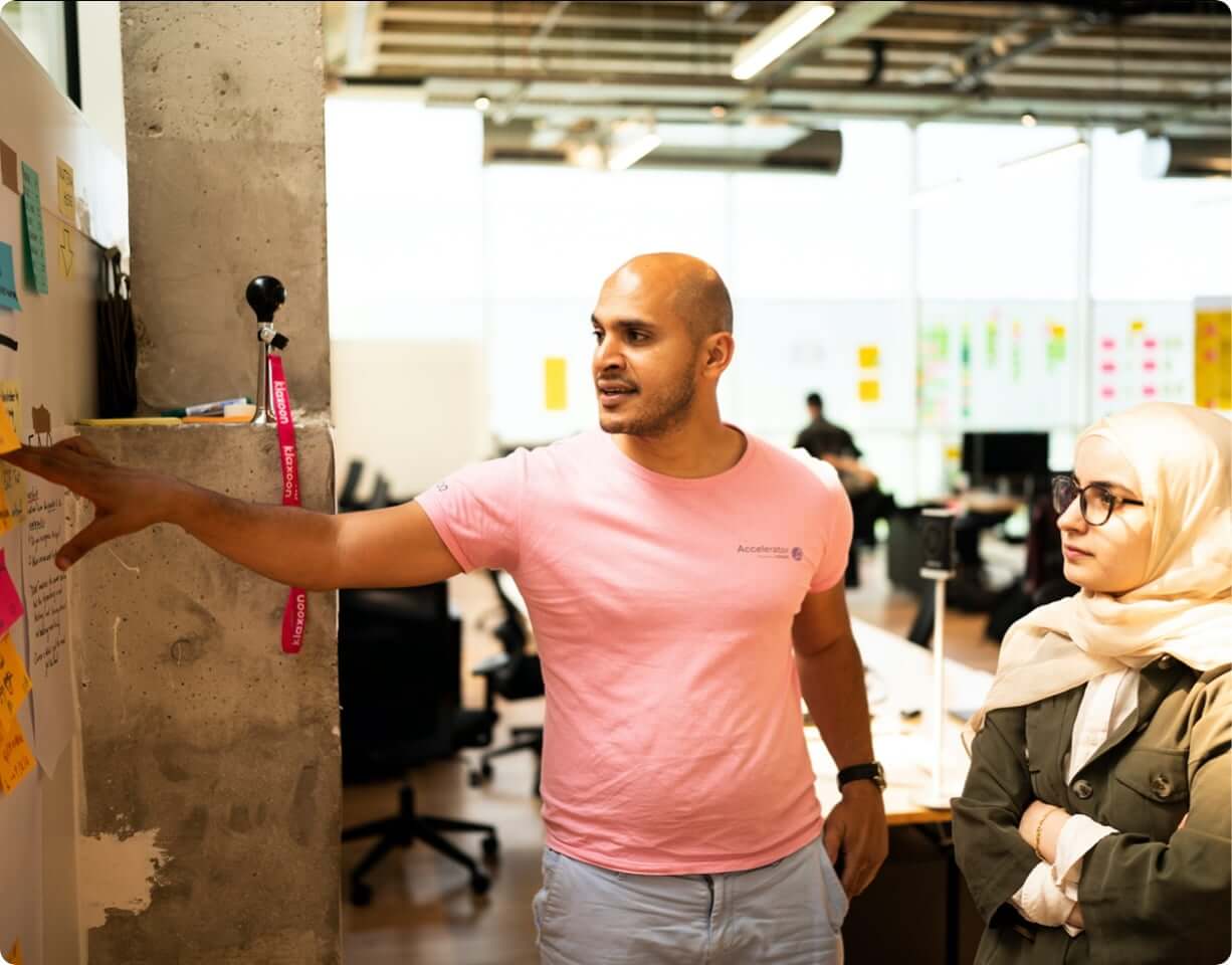 Man presenting to another coworker
