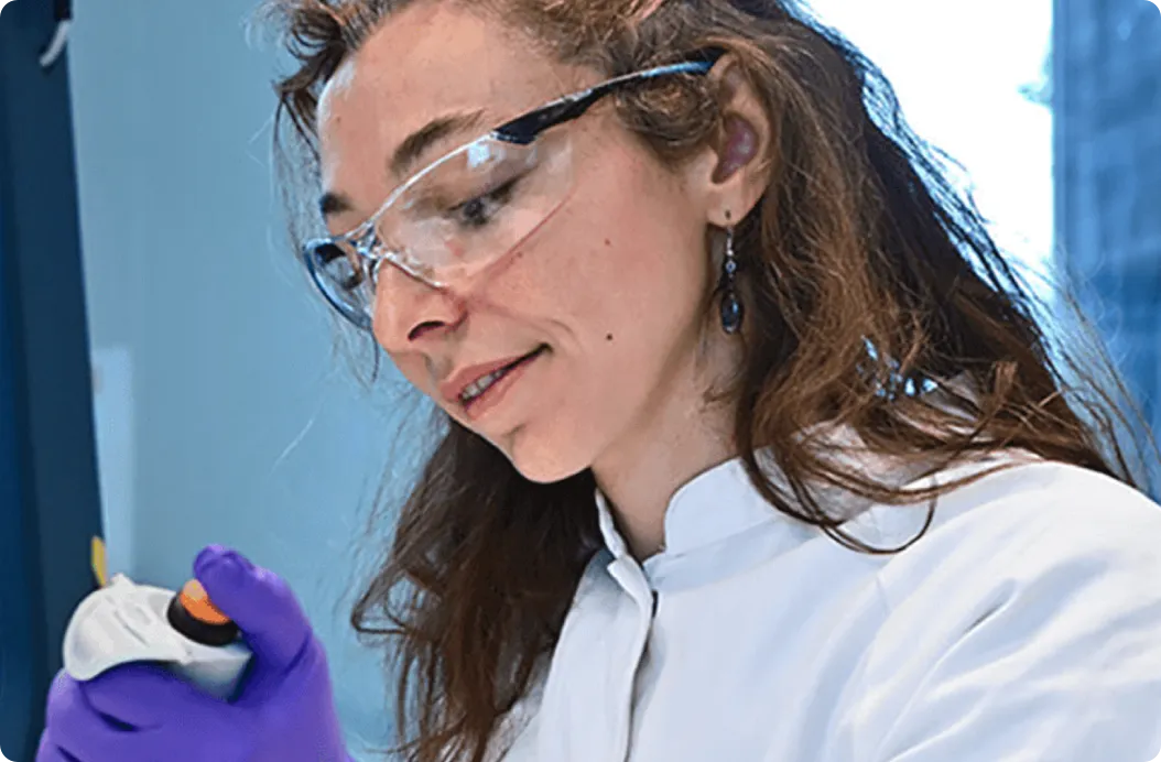 A young woman in lab coat