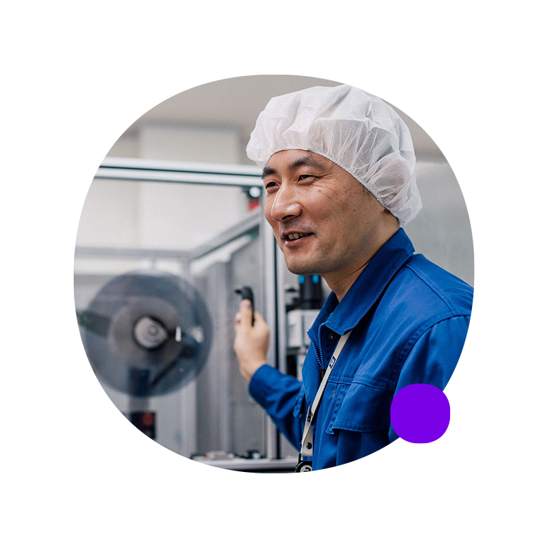 Employee in sterile clothing working in a lab