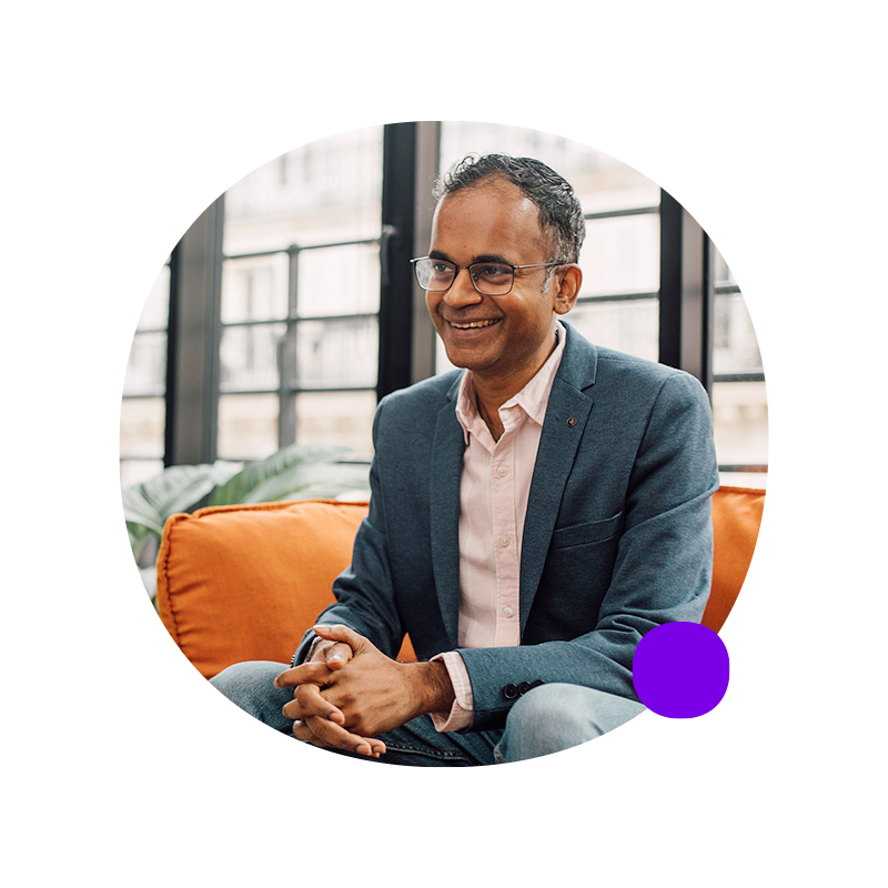 Woman bicycling past the Eiffel Tower