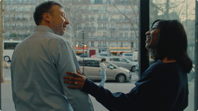 2 colleagues speaking, standing at the entrance of a building. Play video -   Sanofi - How do we chase the Miracles of Science?