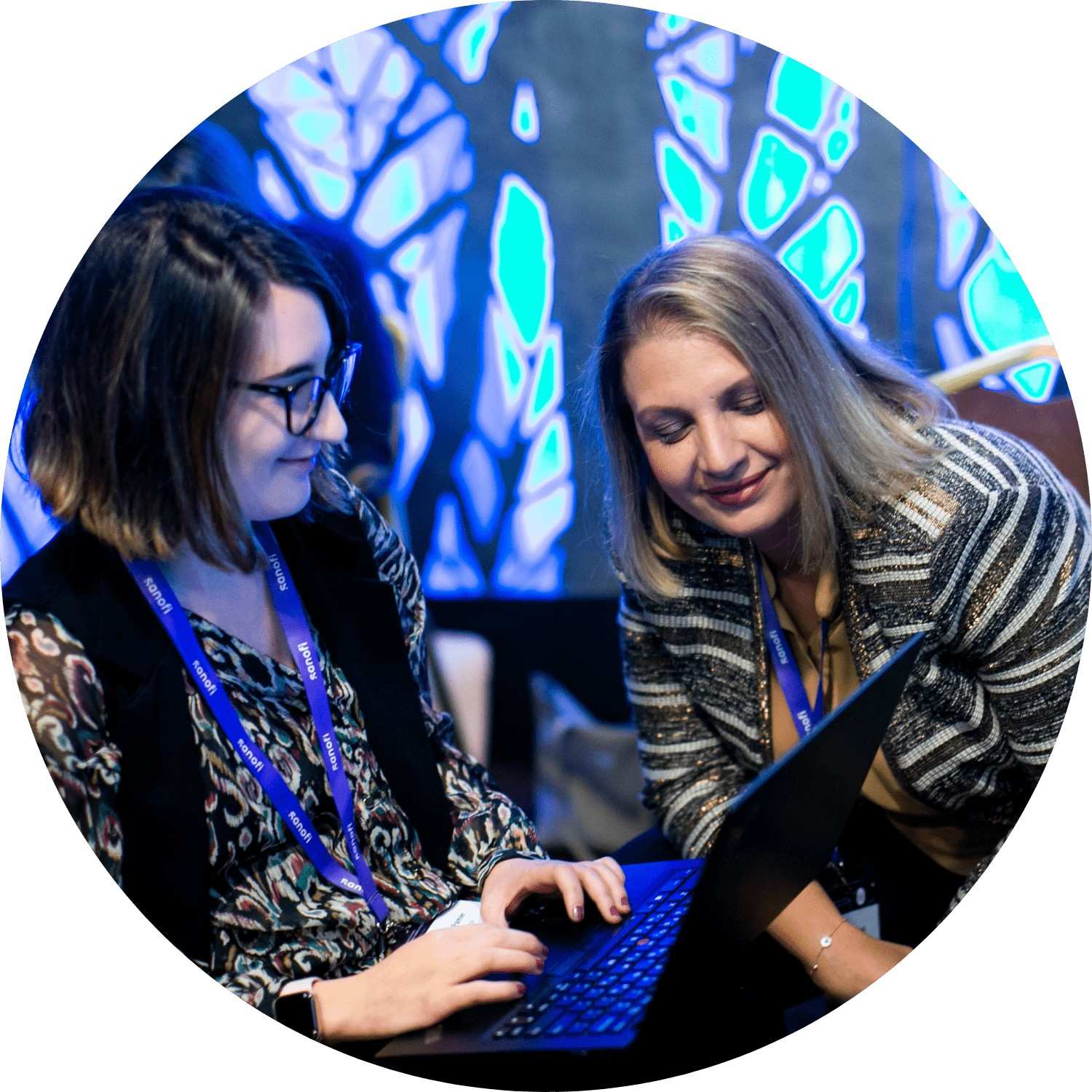 Man walking into workspace with "Accelerator: powered by Sanofi" written on the window