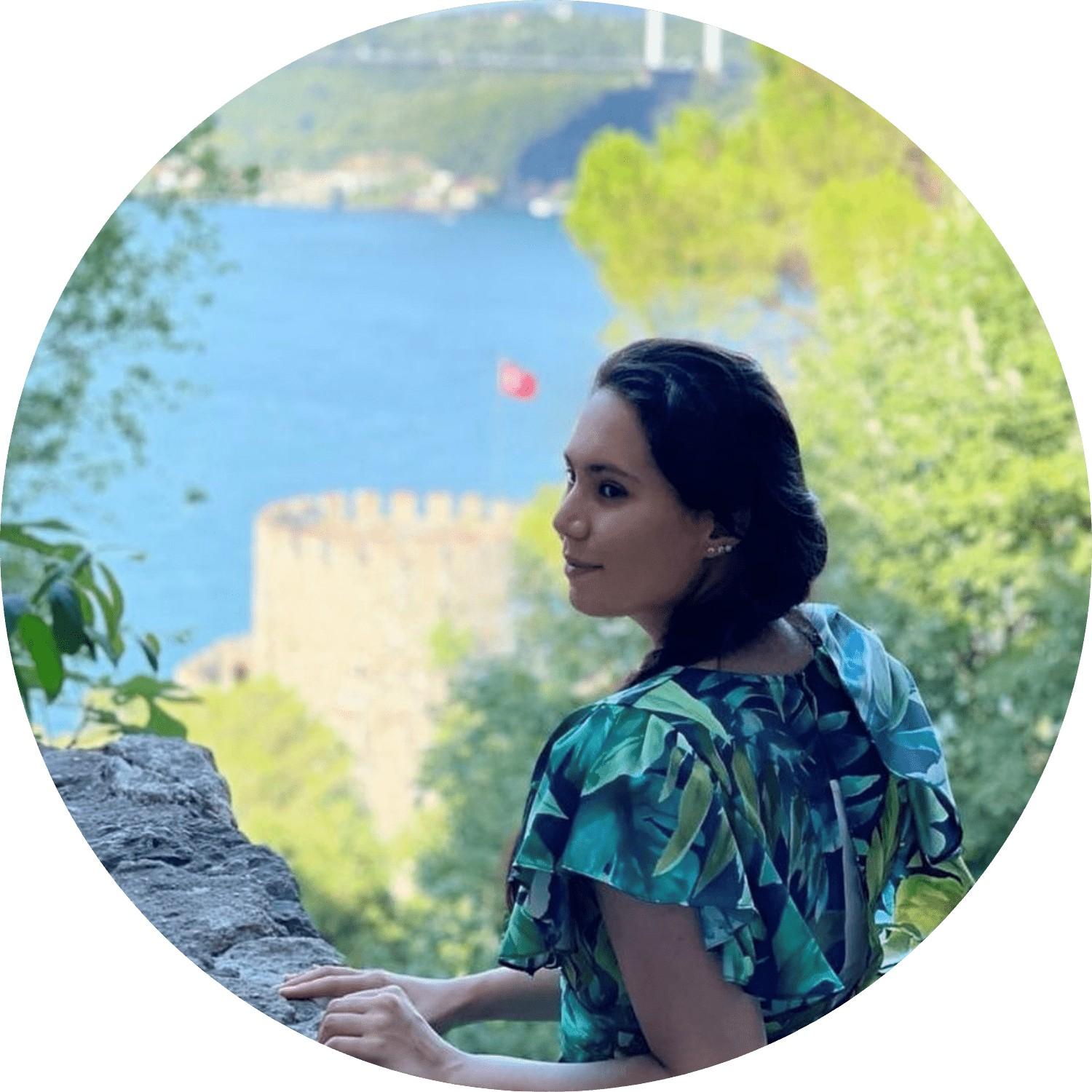 Two women - one in hijab, the other not - laughing together