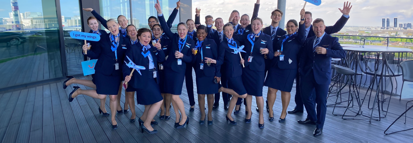 TUI Cabin Crew in Belgium celebrating their wings on a roof top