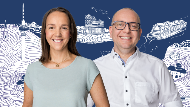 A male and female colleague smiling in front of a blue background with white cruise ships on it