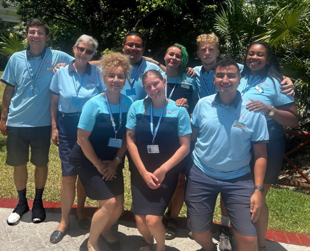 A large group of TUI Hotel reps stand smiling in Mexico