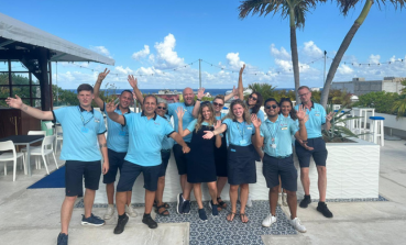 A large group of TUI Reps stand smiling in Mexico
